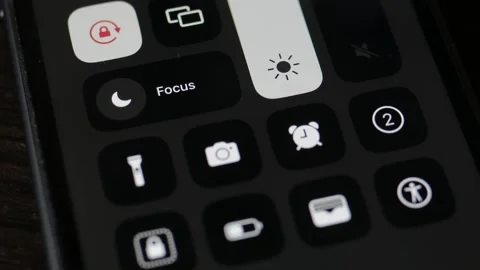 Pressing a finger on the screen recording button on an iPhone. Stock Footage 239088997