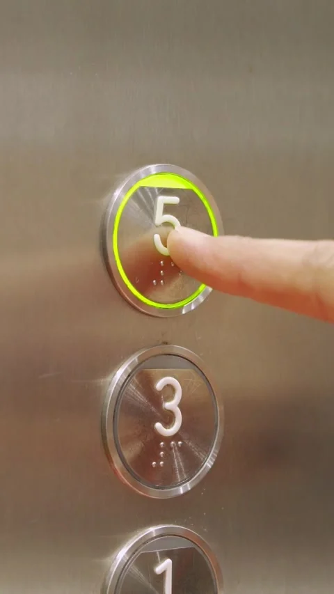 Pressing a five button in an elevator Stock Footage 337033485