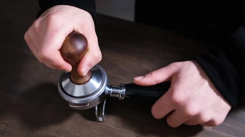 Pressing ground coffee for espresso, fa01 Stock Footage 277907701