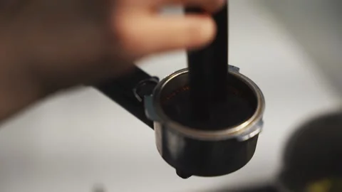 Pressing ground coffee in a holder Stock Footage 308224118