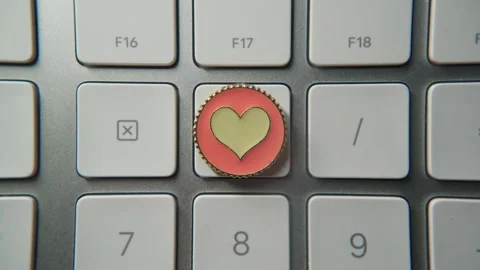 Pressing heart shape button on keyboard Stock Footage 300848715