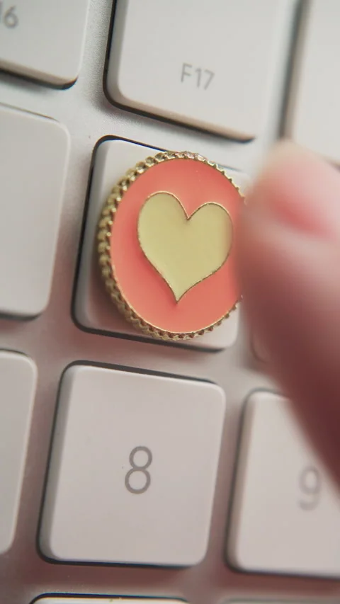 Pressing heart shape button on keyboard repeatedly Stock Footage 300849026