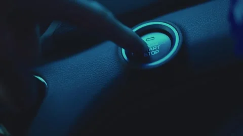 Pressing ignition start button in car, close up Stock Footage 256046654