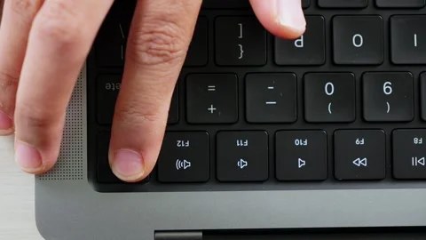 Pressing Laptop Power Button From Top View 動画素材 347626688
