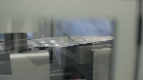 Pressing Machine Creating Pockets for Capsule Blister Packaging Stock Footage 68643039
