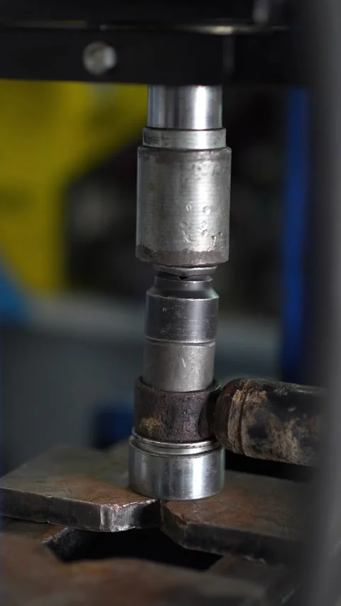 Pressing Metal Rod into Clamp in Workshop Setting Stock Footage 345568708