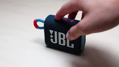 Pressing minus button on JBL GO3 Speaker Stock Footage 282185301
