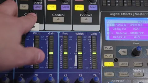 Pressing the mix/pan button on an audio recording studio audio mixing board Stock Footage 89501857