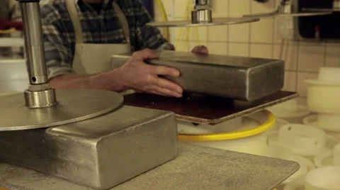 Pressing a mold with curd to Goude cheese Video stock 36195770