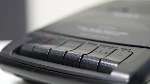 Pressing play and stop button on answering machine Stock Footage