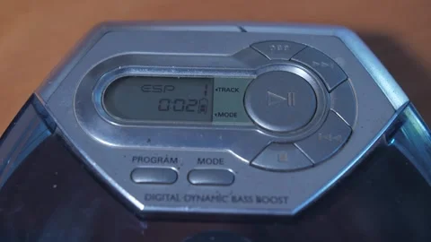 Pressing the play button on a CD player 4k Stock Footage 289141617