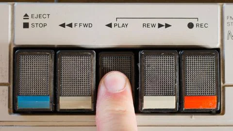 Pressing Play Button on a Retro Cassette Player Stock Photos