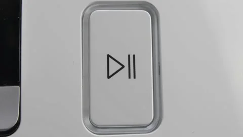 Pressing Play Pause Button on the Device Multiple Times Close-Up Stock Footage 147963286