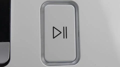 Pressing Play Pause Button on the Device Multiple Times Close-Up Stock Photos