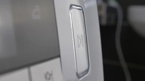 Pressing Play Pause Button on the Device Multiple Times Close-Up Stock Photos