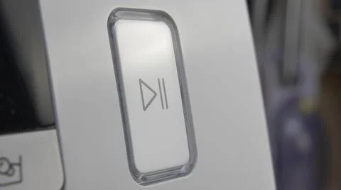 Pressing Play Pause Button on the Device Multiple Times Close-Up Stock Photos