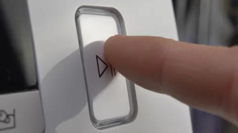 Pressing Play Pause Button on the Device Multiple Times Close-Up Stock Photos