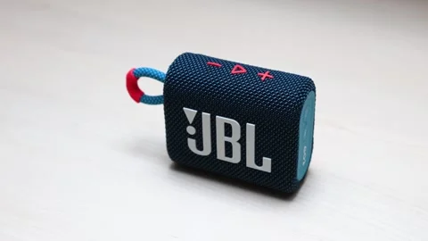 Pressing plus button on JBL GO3 Speaker Stock Footage 282185299