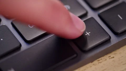 Pressing plus key close up. Pushing the addition button on a numeric keyboa.. Stock Footage 340959108