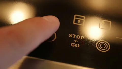 Pressing power button on ceramic cooktop 4K video Stock Footage 89271065