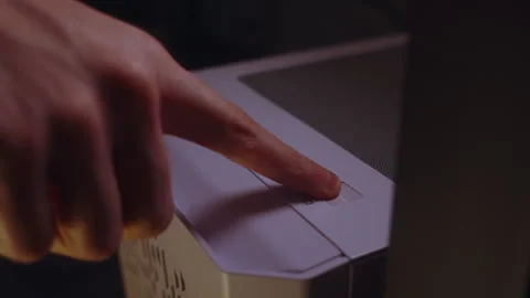 Pressing the power button on a desktop computer Stock Footage 327270799