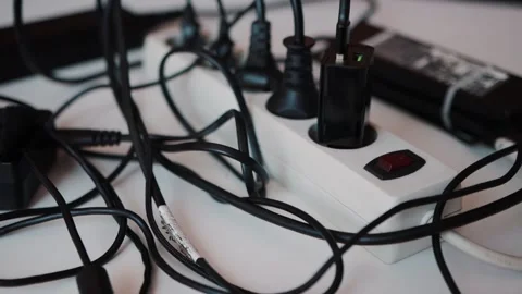 Pressing the power button of an electrical surge protector with black wires Видео 253472589