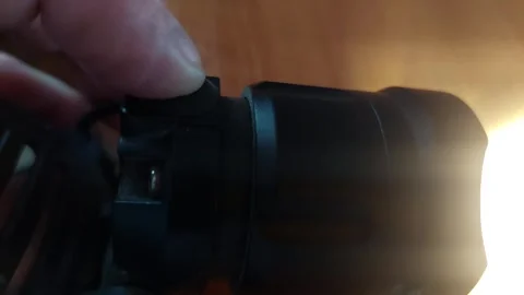 Pressing Power Button on LED Headlamp Flashlight Vídeos de archivo 333644078