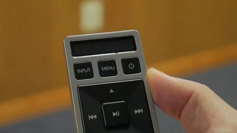 Pressing Power on Remote Vidéo 76943308