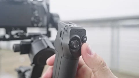 Pressing Record Button on DJI RS 5 Briefcase Handle Stock Footage 332686933