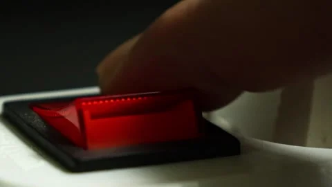 Pressing a red button activates the light, showcasing its bright glow in a Stock Footage 321409042