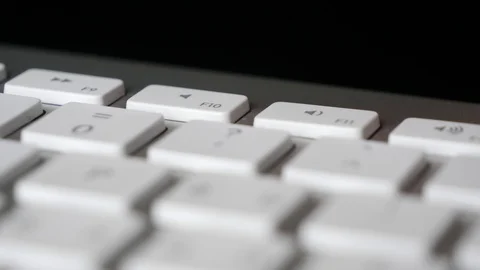 Pressing repeatedly the Mute (F10) button on keyboard. Close-up Stock Footage 125406526