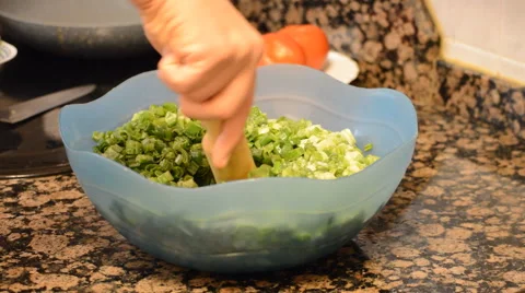 Pressing Spring Onions Stock Footage 52056924
