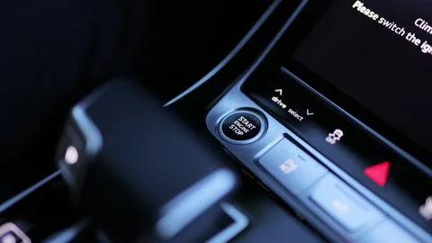 Pressing Stand By Power Button To Turn On and Off the Hybrid Car. Pushing start Stock Footage 335936045