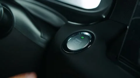 Pressing the start button in the car, starting the engine by button Stock Footage 301523668