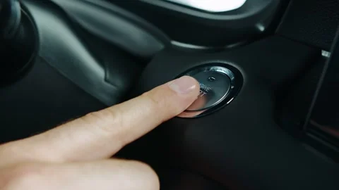 Pressing the start button in the car, starting the engine by button Stock Footage 301523896