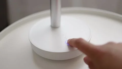 Pressing start engine button on white modern electric fan Finger press button to Stock Footage 162977009