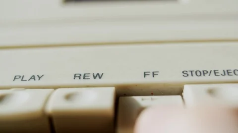 Pressing stop and fast forward on a Cassette Player Video stock 106571544