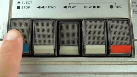Pressing Stop Button on a Vintage Tape Player Stock Footage 93929261