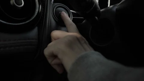 Pressing stop engine of a car Stock Footage 87245727
