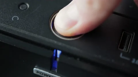 Pressing your finger on the computer shutdown button on the system unit. Blue Stock Footage 158138708