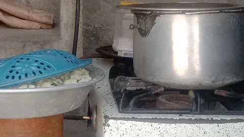 Pressure Cooker Placed on a Traditional Thali in the Kitchen Video stock 346876953