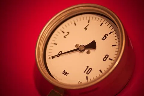Pressure gauge on red background Stock Photos