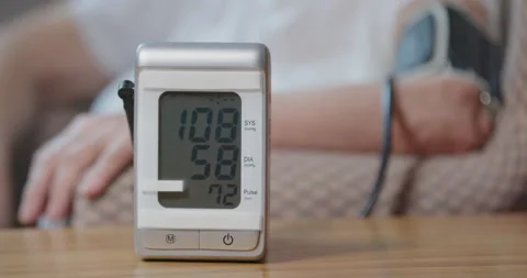 Pressure measuring device on table, man in background. Stock Footage 140511645
