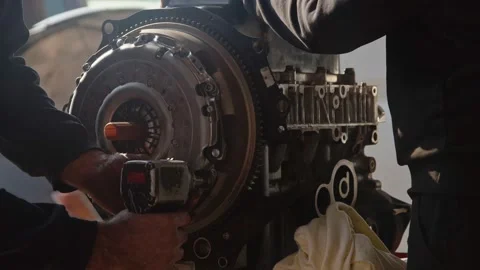 Pressure Pad Flywheel Replacement with Air Gun in Car Repair Shop Stock Footage 221949816