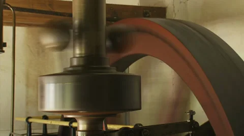 Pressure regulator and flywheel of 19th century steam engine in operation Stock Footage 34223374
