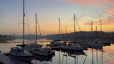 PRESTON Docks, UK 2024 Dec 04; December sunrise reflections of moored yachts Stock Footage 294522430