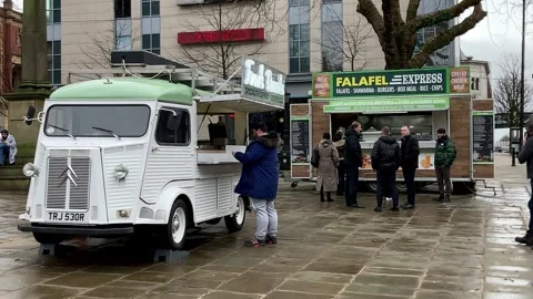 Preston, UK 01/25/24 Queue for Falafel Express street food. Stock Footage 262651988