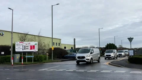 Preston, UK 02/10/2024 Several Amazon delivery vehicles leaving depot Stock Footage 264096162