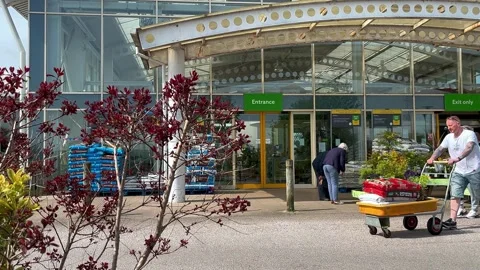 Preston, UK 2024 May 02 ; Garden centre Spring sunny day purchases Stock Footage 274332003