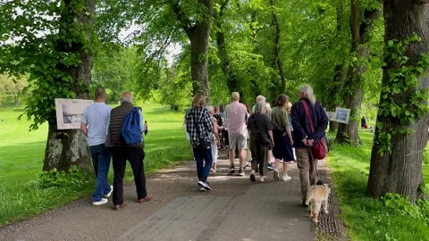 Preston,UK 2026 May 23: Crowds at the opening of pedestrian Tram Bridge 4k video Stock Footage 335518325